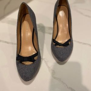 High heels, size 7 1/2, flannel exterior with a black bow across the front